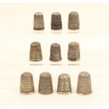 Ten English silver thimbles, most with decorative borders, one with Rd. No. 210800.  (10)