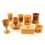 Eight pieces of Mauchline ware, comprising; a barrel form money box (Folkstone Form The Pier
