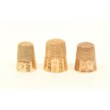 Three American gold thimbles, with alternate engraved and plain panels, two initialled.  (3)