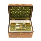 A mid-Victorian rectangular sewing box, the figured walnut ground with geometric inlaid borders to