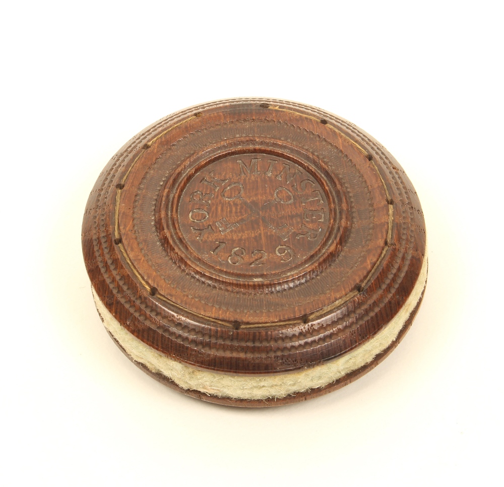 A turned oak relic pincushion of disc form, one side stamped to the centre with cross keys and "York