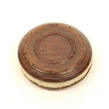 A turned oak relic pincushion of disc form, one side stamped to the centre with cross keys and "York