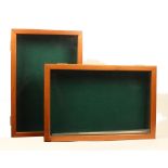 A pair of modern purpose-built counter display cases for sewing tools, in teak finish, glazed hinged