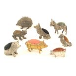 Eight metal animal form standing pincushions, comprising; soft metal hedgehog, 6.5cm, a parrot, 4cm,