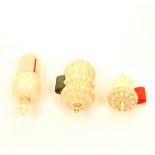 Three good 19th century ivory tape measures, all of acorn form, with spindle winders, comprising;