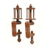 A good pair of rosewood winding clamps, the ring turned rectangular frames with roundel turned