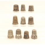 Ten silver thimbles, mostly American or continental, all with decorative borders.   (10)