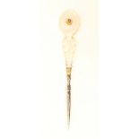 A good mother of pearl Palais Royal mounted steel stiletto, the carved handle with circular gilt and