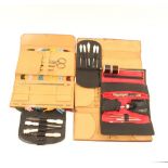 Five sewing cases and tool cards, comprising; a red leather folding rectangular example by "Lockwood