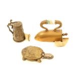 Three brass novelty tape measures, comprising; an iron with agate 'insulator' to handle, complete