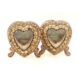 A pair of Victorian heart shaped shellwork frames, each with a central heart shaped glazed insert