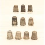 Ten English silver thimbles, most with decorative borders.  (10)