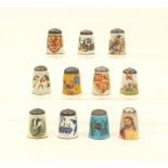 Eleven English silver and transfer enamel thimbles, by James Swann and Son, various subjects.  (11)