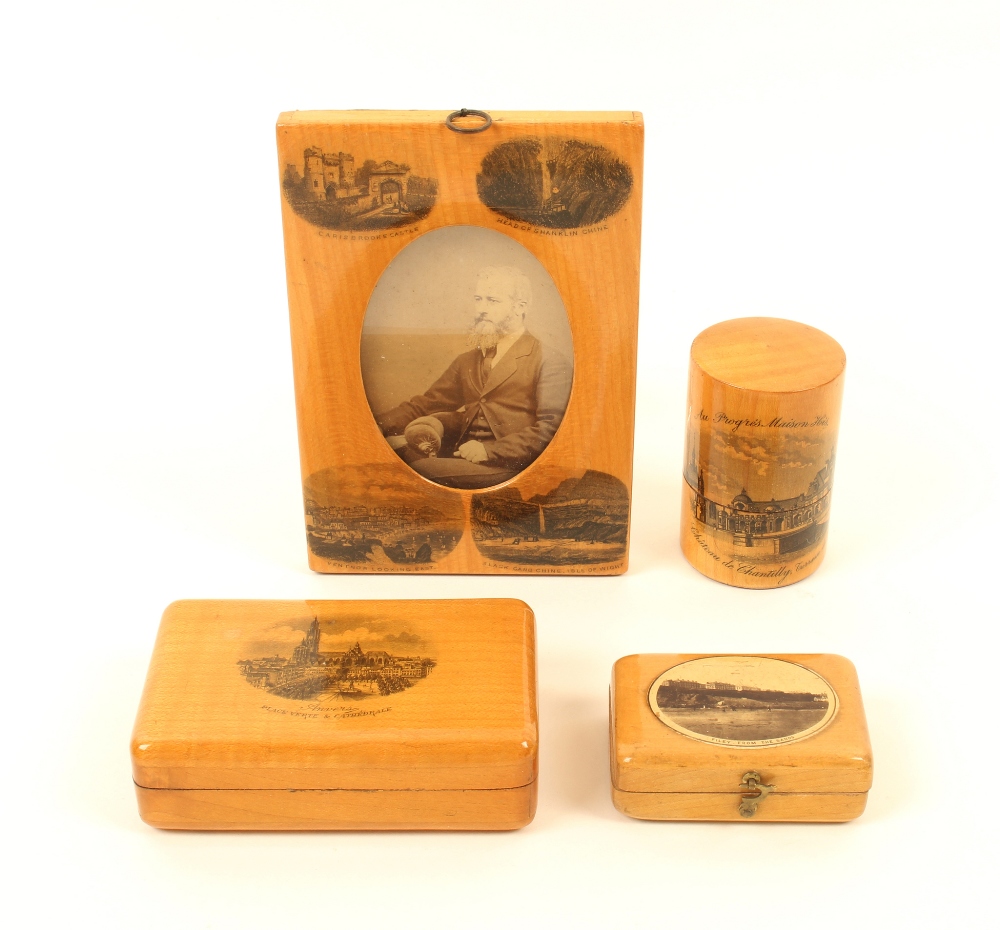 Four pieces of Mauchline ware, comprising; a rectangular photograph frame with oval aperture (