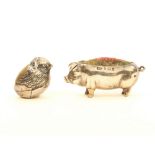 Two silver pincushions, comprising; a standing pig, Birmingham, 1903, 5cm, and a chick with a full