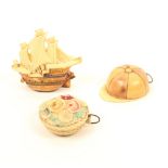 Three plastic novelty tape measures, comprising; a jockey cap, 4.8cm, a galleon, 6cm, and a basket