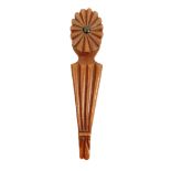 A 19th century mahogany knitting stick, the oval mount with fan form radial carving centred by an