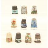 Ten enamel decorated thimbles, including an example with floral border, stamped "925", another to