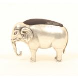 An Edwardian novelty silver pincushion, in the form of an elephant, of unusually large size, by Adie