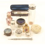 Nine small bottles and jars, three with silver lids, one in silver, a flashed glass scent bottle,