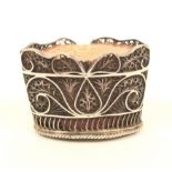 An 18th century English silver filigree pincushion of oval basket form, with oval base panel and