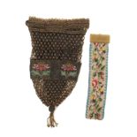 A beadwork bag and a bracelet, the bag of intricate form with a trellis design and a band of
