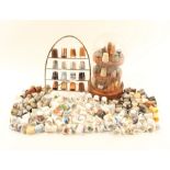 A collection of thimbles in various materials, mostly modern, together with a glass dome with turned