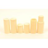 Six turned ivory 19th century cylinder boxes and cases, one of bottle form, one lacking screw cover,