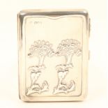 A heavy silver visiting card case, side opening, one side with two Art Nouveau style flowerheads,