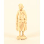 A good Dieppe carved ivory standing needlecase, in the form of a fisherman in traditional costume,