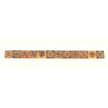A Tunbridge ware rosewood ruler, 12 inches, divided into one inch segments with panels of stickware,