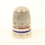 A silver and enamel thimble, 'A Stitch For the Red, White and Blue', minor loss to red, white and