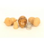 Three vegetable ivory thimble cases, comprising; an acorn form example with hatched and spiral