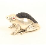 A good Edwardian novelty silver pincushion in the form of a crouching frog, with blue velvet cushion