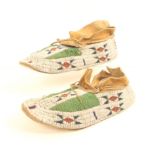 A pair of American Indian fully beaded moccasins, probably Cheyenne, late 19th century, the