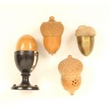 Four thimble cases, comprising; two vegetable ivory acorn form examples, one with vegetable ivory