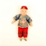 A late 19th century Chinese export doll of a boy, painted composition face, hands and feet, cloth