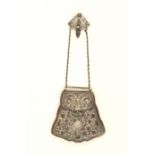 A leather and silver mounted sporran form purse of shaped outline, the pierced, chased and