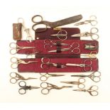 A collection of scissors, including three stork form pairs, two folding pairs, button holing pair,