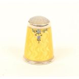 A Norwegian silver thimble, the yellow basse-taille ground with a small grouping of flowers below