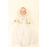 An Armand Marseille bisque head doll, impressed 'Baby Gloria/Germany', closing eyes, kiss curl