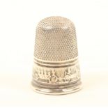 A rare English silver thimble of small size, the frieze with a continuous band of an early railway