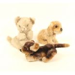 A small plush toy dog, moveable legs, 17.5cm, another dog, seated, 11cm, and a kitten, 12cm high. (