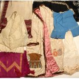 A mixed group of accessories and textiles, including a gentleman's cream damask waistcoat, two pairs
