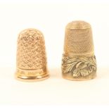 Two gold thimbles, comprising; an early 19th century example with frosted frieze and raised scroll