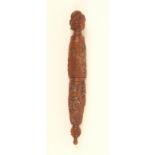 A carved coquilla nut needlecase, the body carved with flowers, the finial as a turbanned man, a.