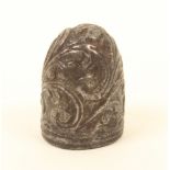 An Italian steel thimble, late 17th/early 18th century, reeded rim below a design of leaf scrolls.(