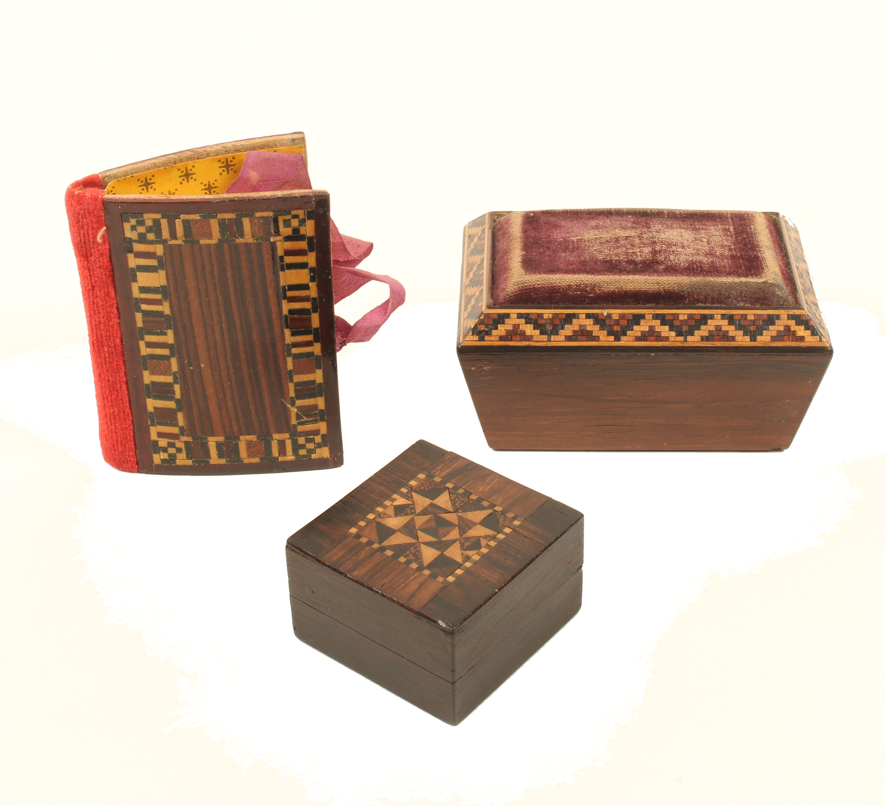 Three pieces of Tunbridge ware, comprising; a rosewood sarcophagus form pincushion with canted