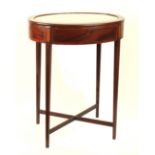 A 19th century mahogany and inlaid oval bijouterie table, the hinged lid with inset bevel edge glass