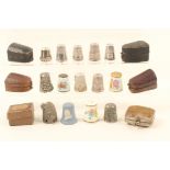 Thimbles and thimble cases, comprising; ten silver or white metal examples, one with enamel shield